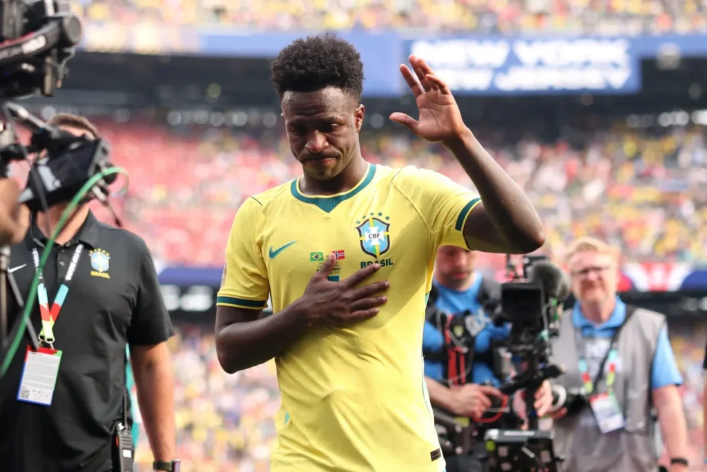 EAST RUTHERFORD, NEW JERSEY - JULY 05: Vinicius Junior #7 of Brazil applauds fans after the team's 1-2 defeat in the FIFA World Cup 2026 Round of 16 match between Brazil and Norway at New York New Jersey Stadium on July 05, 2026 in East Rutherford, New Jersey. (Photo by Maddie Meyer - FIFA/FIFA via Getty Images) • FIFA via Getty Images